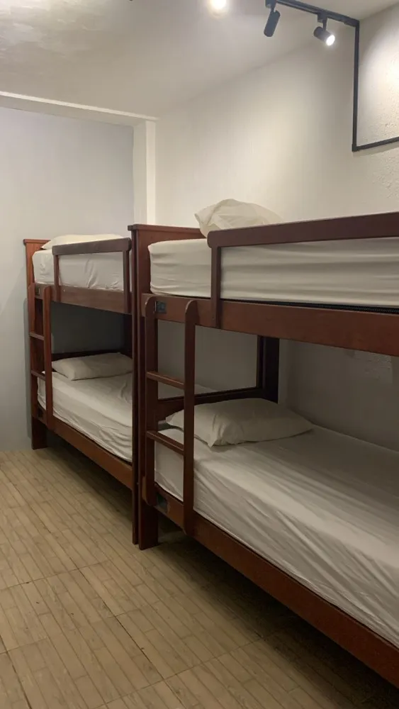 Female Dorm 6 at Iduna Hostel with wooden bunk beds