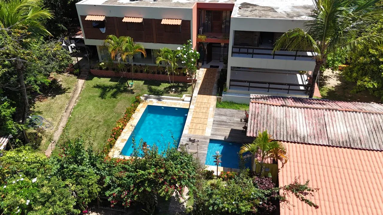 Aerial view of Iduna Hostel with the swimming pool, garden and main building